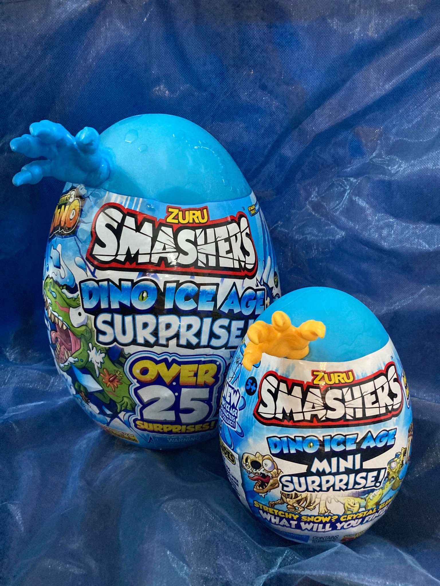 ZURU Smashers Dino Ice Age Surprise Egg – Uovo Gigante Con Raptor Smash-o-sauro – Oltre 25 Sorprese E Neve Che Cresce